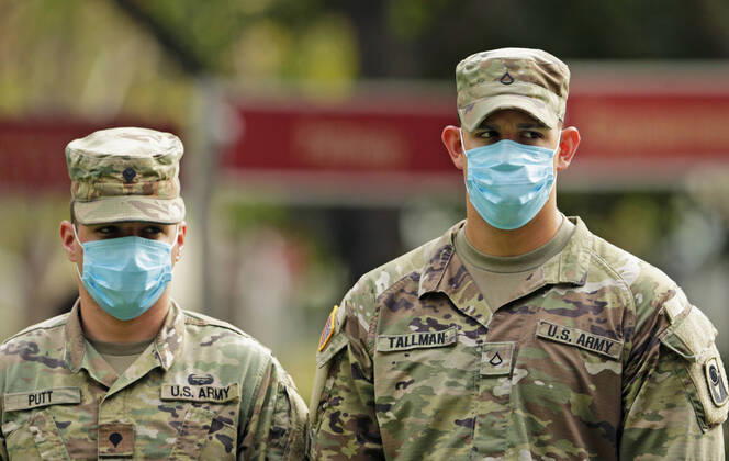 April 17, 2020, Fort Lauderdale, FL, USA: Florida Army National Guard soldiers wear protective masks during Florida Gov. Ron DeSantis press conference at the Urban League of Broward County to announce that Florida s first two walk-through coronavirus testing sites will be opening in Broward County as the Novel Coronavirus pandemic continues on Friday, April 17, 2020 in Fort Lauderdale, Fla. The sites will open for testing on Saturday and will start with 200 tests per day, Gov. DeSantis said. Fort Lauderdale USA - ZUMAm67_ 20200417_zaf_m67_028 Copyright: xDavidxSantiagox