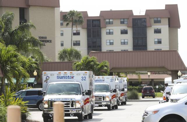April 17, 2020, Seminole, Florida, USA: Ambulances line the entrance before the remaining 39 residents are evacuated from Freedom Square of Seminole, Friday, April 17, 2020 in Seminole. Three nursing home residents have died of the coronavirus in an outbreak that has afflicted Freedom Square of Seminole, a sprawling retirement community that has seen dozens of residents hospitalized because of the virus, officials said. Seminole USA - ZUMAs70_ 20200417_zan_s70_032 Copyright: xDirkxShaddx
