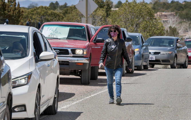 April 17, 2020, USA: Gaile Herling, with Bend the Arc New Mexico, leads a group protesting from their vehicles outside the Governor s Mansion in Santa Fe, Friday April 17, 2020. The protest that consist of 13 vehicles were there to send a message to the Governor to release all the inmates from the jails and prisons in the state due to the COVID-19 outbreak. They are also asking her to put pressure on ICE to release immigrants from detention. USA - ZUMAab1_ 20200417_zaf_ab1_003 Copyright: xEddiexMoorex