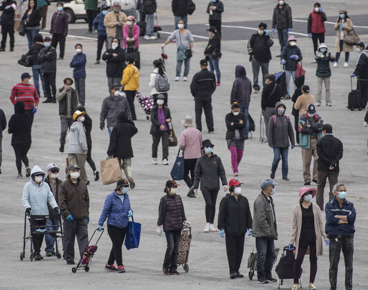 People line up to receive bags of food from the San Francisco-Marin Food Bank in the parking lot of the Cow Palace in Daly City, California on Friday, April 17, 2020. Local food banks have moved into high gear as the Coronavirus has hit the food insecure especially hard.  SXP2020041604 TERRYxSCHMITT