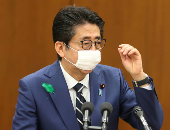 April 17, 2020, Tokyo, Japan - Japanese Prime Minister Shinzo Abe wearing a face mask answers a question at Lower House s health, labour and welfare committee session at the National Diet in Tokyo on Friday, April 17, 2020. Abe expanded a state of emergency across Japan to prevent outbreak of the new coronavirus on April 17.  (125461095)
