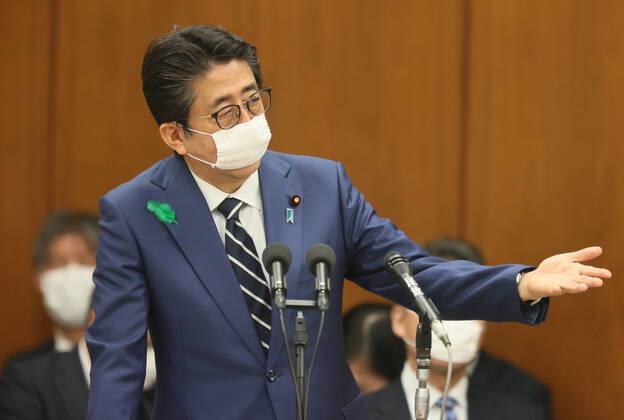 April 17, 2020, Tokyo, Japan - Japanese Prime Minister Shinzo Abe wearing a face mask answers a question at Lower House s health, labour and welfare committee session at the National Diet in Tokyo on Friday, April 17, 2020. Abe expanded a state of emergency across Japan to prevent outbreak of the new coronavirus on April 17.  (125461121)