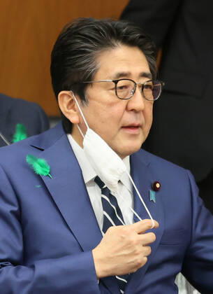 April 17, 2020, Tokyo, Japan - Japanese Prime Minister Shinzo Abe wears a face mask after he drank water at Lower House s health, labour and welfare committee session at the National Diet in Tokyo on Friday, April 17, 2020. Abe expanded a state of emergency across Japan to prevent outbreak of the new coronavirus on April 17.  (125461130)