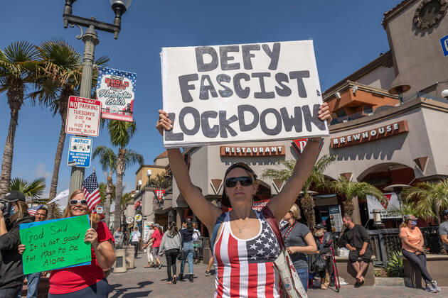April 17, 2020, Huntington Beach, California, U.S: Over 100 people peaceful rallied on Main Street in Huntington Beach demanding their city and country to reopen due to Covid-19 on Friday April 17, 2020. Huntington Beach U.S. - ZUMAw134 20200417_zap_w134_015 Copyright: xKevinxWarnx