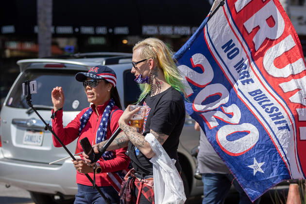 April 17, 2020, Huntington Beach, California, U.S: Over 100 people peaceful rallied on Main Street in Huntington Beach demanding their city and country to reopen due to Covid-19 on Friday April 17, 2020. Huntington Beach U.S. - ZUMAw134 20200417_zap_w134_021 Copyright: xKevinxWarnx