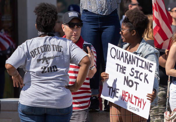April 17, 2020, Huntington Beach, California, U.S: Over 100 people peaceful rallied on Main Street in Huntington Beach demanding their city and country to reopen due to Covid-19 on Friday April 17, 2020. Huntington Beach U.S. - ZUMAw134 20200417_zap_w134_025 Copyright: xKevinxWarnx