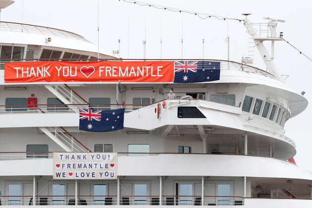 ARTANIA CRUISE SHIP DEPARTURE, A crew member looks on as the cruise ship Artania prepares to depart Fremantle harbour on Saturday, April 18, 2020. The MV Artania arrived in Fremantle over three weeks ago and a reported 79 crew and passengers have tested poitive for coronavirus. Two crew members and one passenger have died from the virus. ( NO ARCHIVING, EDITORIAL USE ONLY, NO USE IN BOOKS WITHOUT CONSENT PERTH WA AUSTRALIA  Copyright: xRICHARDxWAINWRIGHTx 20200418001464069683