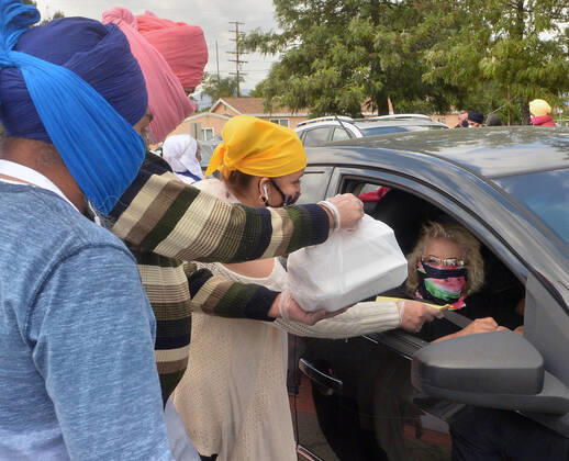 Free warm vegetarian meals are distributed to the public at the Khalsa Care Foundation amid the coronavirus pandemic in in Los Angeles on Friday, April 17, 2020.  LAP2020041727 JIMxRUYMEN