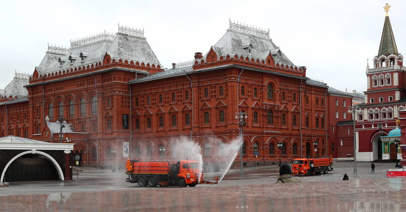MOSCOW, RUSSIA - APRIL 18, 2020: Utility machines disinfecting the pavement of Tverskaya Street with a special solution recommended by the Russian Federal Service for Surveillance on Consumer Rights Protection and Human Wellbeing (Rospotrebnadzor) amid the COVID-19 coronavirus pandemic. Alexander Shcherbak TASS  TS0D62FA