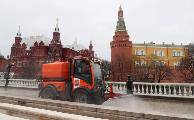 MOSCOW, RUSSIA - APRIL 18, 2020: A utility machine disinfecting the pavement of Manezhnaya Street with a special solution recommended by the Russian Federal Service for Surveillance on Consumer Rights Protection and Human Wellbeing (Rospotrebnadzor) amid the COVID-19 coronavirus pandemic. Alexander Shcherbak TASS  TS0D6305