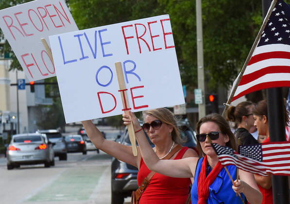 April 17, 2020, Orlando, Florida, United States: Protesters demonstrate outside the Orange County Administration Building demanding the end of stay-at-home orders and the reopening of Florida businesses as the COVID-19 pandemic keeps thousands of people in their homes and out of work. Orlando United States - ZUMAs197 20200417_zaa_s197_222 Copyright: xPaulxHennessyx