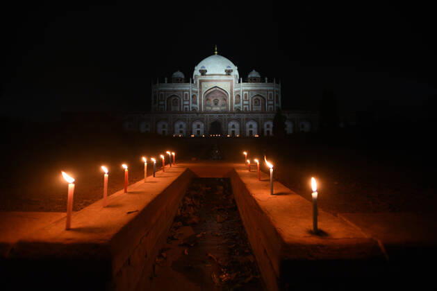 NEW DELHI, INDIA - APRIL 18: Humayun s Tomb seen in the night with candles lit by ASI workers in solidarity with coronavirus frontline personnel on World Heritage Day, on April 18, 2020 in New Delhi, India. ASI Delhi Circle organises diya lighting ceremony at Red Fort and Candle lighting ceremony at Qutub Minar and Humayun s Tomb to express our solidarity with all CORONA WARRIORS like sanitation workers, doctors, police officers and Civil administration. (Photo by Ajay Aggarwal Hindustan Times ) ASI Delhi Circle Oganises Diya Lighting Ceremony In Solidarity With Coronavirus Frontline Personnel On World Heritage Day