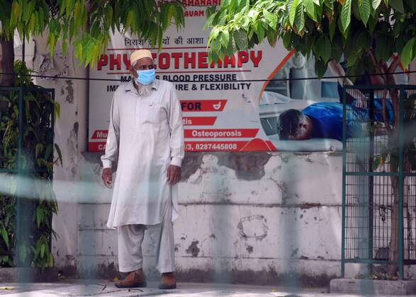 NEW DELHI, INDIA APRIL 18: A person waits to be tested, outside the Swami Parmanand Prakritik Chikitsalaya Yoga & Anusandhan Kendra in Mandawali, on April 18, 2020 in New Delhi, India. (Photo by Raj K Raj Hindustan Times ) India Extends Nationwide Coronavirus Lockdown Until May 3