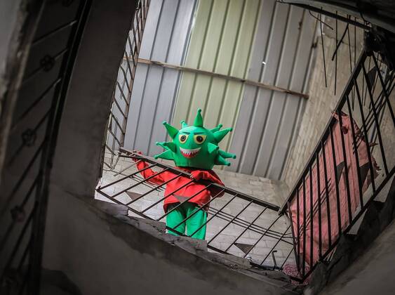 April 18, 2020, Nuseirat Camp, The Gaza Strip, Palestine: Clown wear coronavirus doll in Nuseirat camp in central of the Gaza strip, to awareness kids about the diseases. Nuseirat Camp Palestine - ZUMAq100 20200418_zaa_q100_008 Copyright: xAbedxAlrahmanxAlkahloutx
