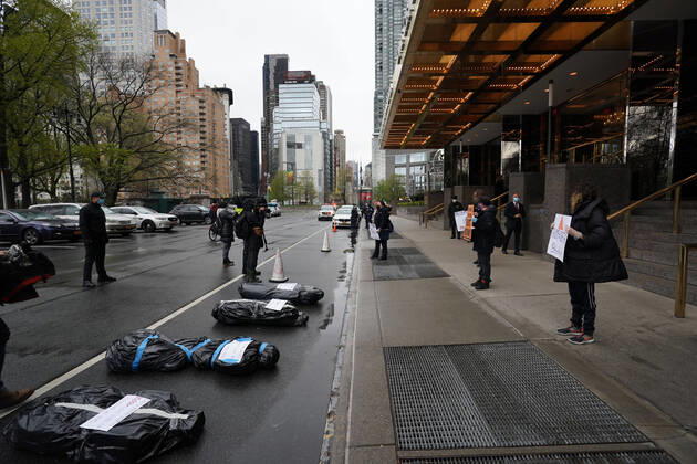 April 18, 2020, New York, NY, USA: Activists with Refuse Fascism deliver body bags props to the Trump International Hotel & Tower New York to protest President TrumpÃ¢â‚¬â ¢s response to COVID-19 on April 18, 2020 in New York. New York USA - ZUMAb148 20200418_zap_b148_136 Copyright: xBryanxSmithx