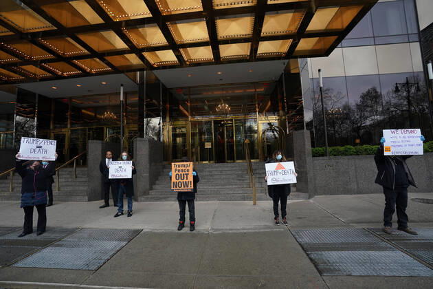 April 18, 2020, New York, NY, USA: Activists with Refuse Fascism deliver body bags props to the Trump International Hotel & Tower New York to protest President TrumpÃ¢â‚¬â ¢s response to COVID-19 on April 18, 2020 in New York. New York USA - ZUMAb148 20200418_zap_b148_143 Copyright: xBryanxSmithx