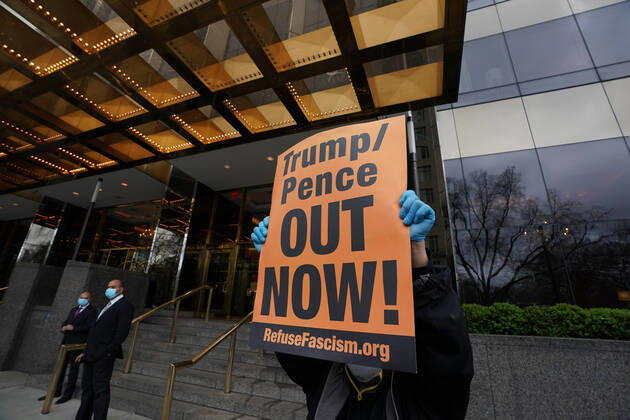 April 18, 2020, New York, NY, USA: Activists with Refuse Fascism deliver body bags props to the Trump International Hotel & Tower New York to protest President TrumpÃ¢â‚¬â ¢s response to COVID-19 on April 18, 2020 in New York. New York USA - ZUMAb148 20200418_zap_b148_156 Copyright: xBryanxSmithx