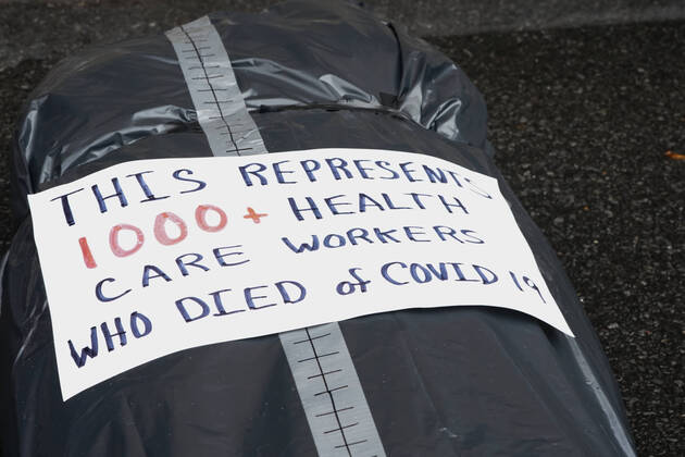 April 18, 2020, New York, NY, USA: Activists with Refuse Fascism deliver body bags props to the Trump International Hotel & Tower New York to protest President TrumpÃ¢â‚¬â ¢s response to COVID-19 on April 18, 2020 in New York. New York USA - ZUMAb148 20200418_zap_b148_161 Copyright: xBryanxSmithx