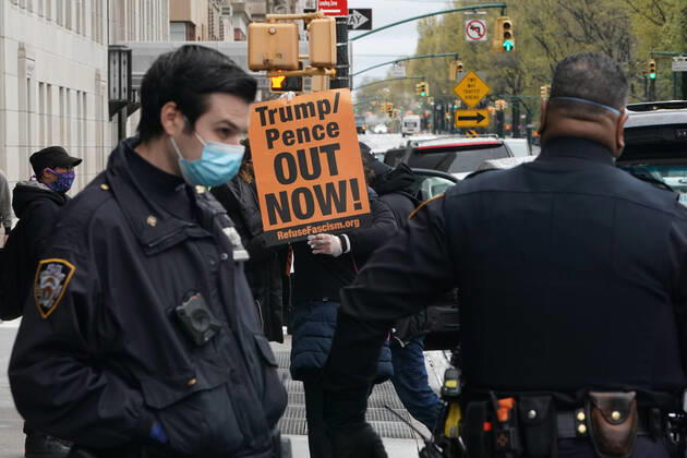 April 18, 2020, New York, NY, USA: Activists with Refuse Fascism deliver body bags props to the Trump International Hotel & Tower New York to protest President TrumpÃ¢â‚¬â ¢s response to COVID-19 on April 18, 2020 in New York. New York USA - ZUMAb148 20200418_zap_b148_162 Copyright: xBryanxSmithx