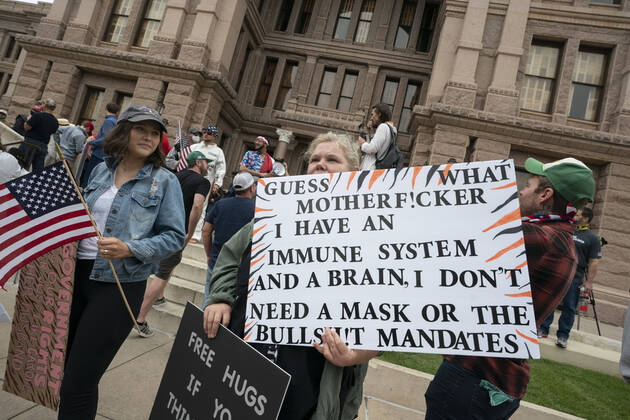 April 18, 2020, Austin, Texas, USA: A few hundred Texans flaunt social distancing guidlines in an InfoWars inspired rally at the Texas Capitol where founder Alex Jones encourages the crowd with right-wing rhetoric. Gov. Greg Abbott announced Friday relaxed restrictions on business starting next week. Austin USA - ZUMAd150 20200418_znp_d150_011 Copyright: xBobxDaemmrichx