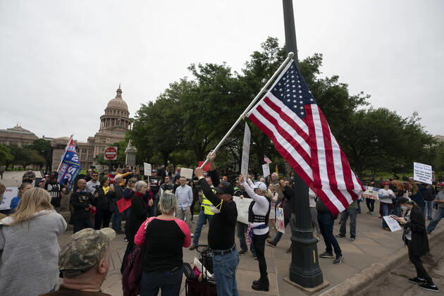 April 18, 2020, Austin, Texas, USA: A few hundred Texans flaunt social distancing guidelines in an InfoWars inspired rally at the Texas Capitol where founder Alex Jones encourages the crowd with right-wing rhetoric. Gov. Greg Abbott announced Friday relaxed restrictions on business starting next week. Austin USA - ZUMAd150 20200418_znp_d150_020 Copyright: xBobxDaemmrichx