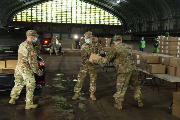 Mayor visit food distribution center in the Bronx Members of National Guard help load boxes for delivery during mayor de Blasio visit food distribution center at Kingsbridge Armory amid COVID-19 pandemic. Temporary food distribution center is set during the COVID-19 crisis, and where TLC licensed drivers pick up meals to deliver to New Yorkers in need. There are more than 11,000 taxi drivers signed up to do this. New York New York United States Copyright: LevxRadin