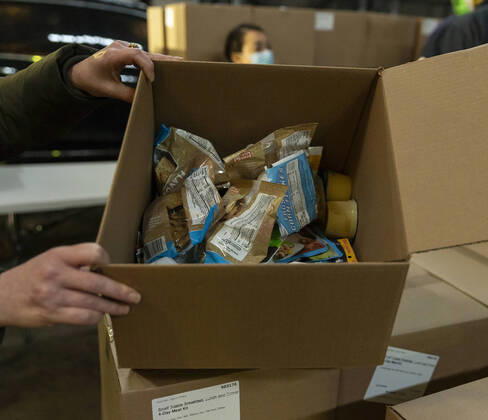 Mayor visit food distribution center in the Bronx Content of box with food ready for delivery on display during mayor de Blasio visit food distribution center at Kingsbridge Armory amid COVID-19 pandemic. Temporary food distribution center is set during the COVID-19 crisis, and where TLC licensed drivers pick up meals to deliver to New Yorkers in need. There are more than 11,000 taxi drivers signed up to do this. New York New York United States Copyright: LevxRadin