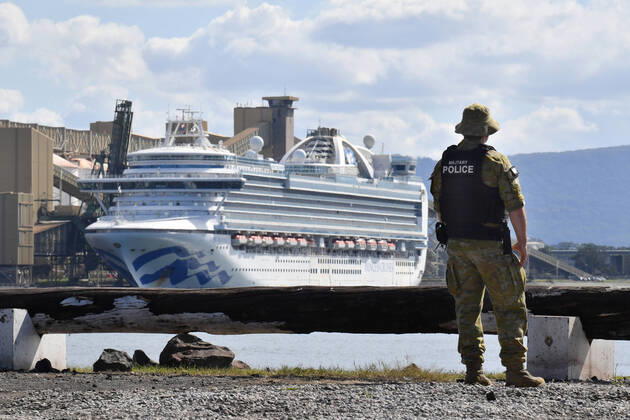 RUBY PRINCESS DEPARTURE, NSW Police and Australian Defence Force Military Police are seen in front of The Ruby Princess cruiseliner which remains docked at Port Kembla, Wollongong, Sunday, April 19, 2020. A criminal investigation has been launched into how cruise line operator Carnival Australia was allowed to disembark Ruby Princess passengers in Sydney, resulting in several deaths and COVID-19 outbreaks throughout the country. The Ruby Princess was due to depart Port Kembla today. ( NO ARCHIVING, EDITORIAL USE ONLY, NO USE IN BOOKS WITHOUT CONSENT WOLLONGONG NSW AUSTRALIA  Copyright: xDEANxLEWINSx 20200419001464194323