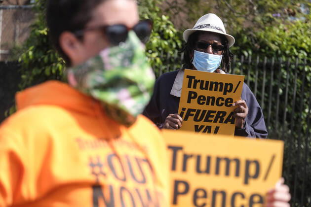 April 18, 2020, Los Angeles, California, U.S: Demonstrators gather before heading to Trump National Golf Club Los Angeles in protest against U.S. President Donald Trump s response to the coronavirus disease (COVID-19) pandemic, in Wilmington, California, April 18, 2020. Los Angeles U.S. - ZUMAc68_ 20200418_zaf_c68_007 Copyright: xRingoxChiux