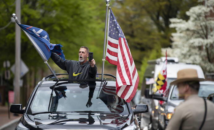 April 18, 2020, Annapolis, Maryland, United State of America: Hundreds of a vehicles gridlock downtown Annapolis, Maryland, April 18th, 2020, in protest of the stay at home order and closing of non-essential businesses by Maryland Governor Larry Hogan. Organizers are urging the governor to reopen businesses, churches and schools, saying there are other ways to social distance without shutting down the economy. ..- Annapolis United State of America - ZUMAa138 20200418_znp_a138_033 Copyright: xPerryxAstonx