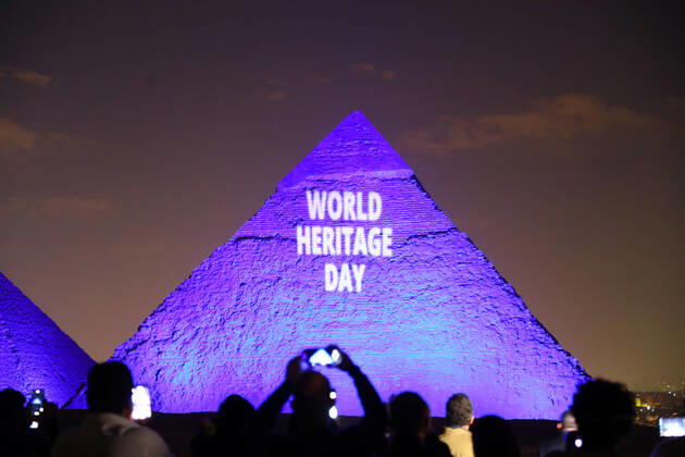 (200418) -- GIZA (EGYPT), April 18, 2020 (Xinhua) -- One of the Giza pyramids is illuminated with words WORLD HERITAGE DAY during the World Heritage Day amid the COVID-19 pandemic in Giza, Egypt, on April 18, 2020. Egypt reported on Saturday 188 new COVID-19 cases, the highest daily increase, bringing the number of confirmed positive cases in the country to 3,032. (Xinhua Ahmed Gomaa) EGYPT-GIZA-PYRAMIDS-COVID-19-WORLD HERITAGE DAY-ILLUMINATION 
