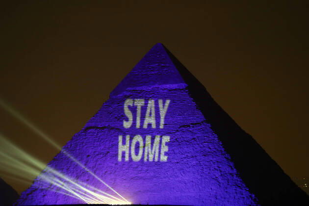 (200418) -- GIZA (EGYPT), April 18, 2020 (Xinhua) -- One of the Giza pyramids is illuminated with words STAY HOME during the World Heritage Day amid the COVID-19 pandemic in Giza, Egypt, on April 18, 2020. Egypt reported on Saturday 188 new COVID-19 cases, the highest daily increase, bringing the number of confirmed positive cases in the country to 3,032. (Xinhua Ahmed Gomaa) EGYPT-GIZA-PYRAMIDS-COVID-19-WORLD HERITAGE DAY-ILLUMINATION 