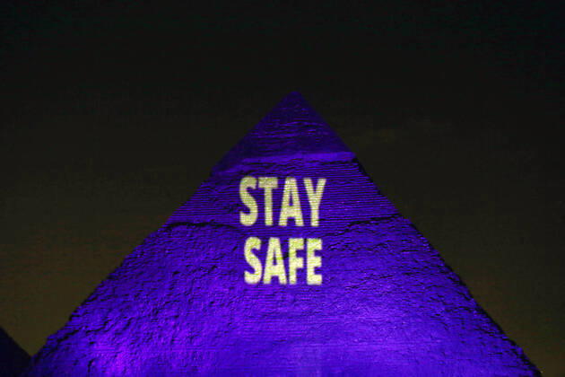 (200418) -- GIZA (EGYPT), April 18, 2020 (Xinhua) -- One of the Giza pyramids is illuminated with words STAY SAFE during the World Heritage Day amid the COVID-19 pandemic in Giza, Egypt, on April 18, 2020. Egypt reported on Saturday 188 new COVID-19 cases, the highest daily increase, bringing the number of confirmed positive cases in the country to 3,032. (Xinhua Ahmed Gomaa) EGYPT-GIZA-PYRAMIDS-COVID-19-WORLD HERITAGE DAY-ILLUMINATION 