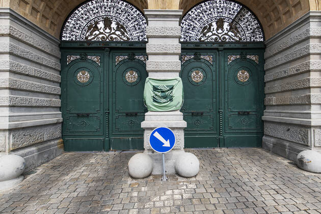 Pilsner Urquell Brewery main gate with a protection face mask is seen on April 18, 2020, in Pilsen, Czech Republic. The brewery bottling beer only into bottles and cans at present. This is due to closed restaurants, pubs and bars due to the coronavirus epidemic. (CTKxPhoto MiroslavxChaloupka) CTKPhotoP202004180315301 cha003