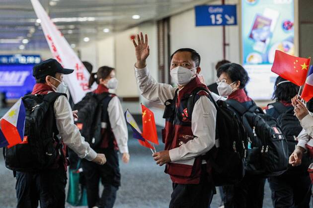 (200419) -- PARANAQUE CITY, April 19, 2020 -- Members of the Chinese Anti-Epidemic Medical Expert Team wave goodbye as they leave Manila for China at the Manila Ninoy Aquino International Airport (NAIA) in Paranaque City, the Philippines, on April 19, 2020. The Philippines on Sunday thanked China anew for its help, saying the crucial medical supplies donated by the Chinese government and the ideas shared by the Chinese experts have provided a lifeline to the Philippines efforts to step up the fight against the COVID-19. Philippine Health Secretary Francisco Duque made the remarks at the seeing-off ceremony held for the 12-member team of Chinese experts, which arrived in Manila on April 5 to share firsthand experiences and best practices with Philippine health officials on how to properly manage the COVID-19 epidemic. ) PHILIPPINES 