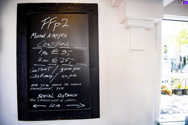 April 19, 2020, Amsterdam, Netherlands: Prices for face masks listed at the store..Opening a face mask store during the corona crisis is very critical. Certified surgical face masks would be sold for 9 euros each and the store can only take cash. Amsterdam Netherlands - ZUMAs197 20200419_zaa_s197_029 Copyright: xRobinxUtrechtx