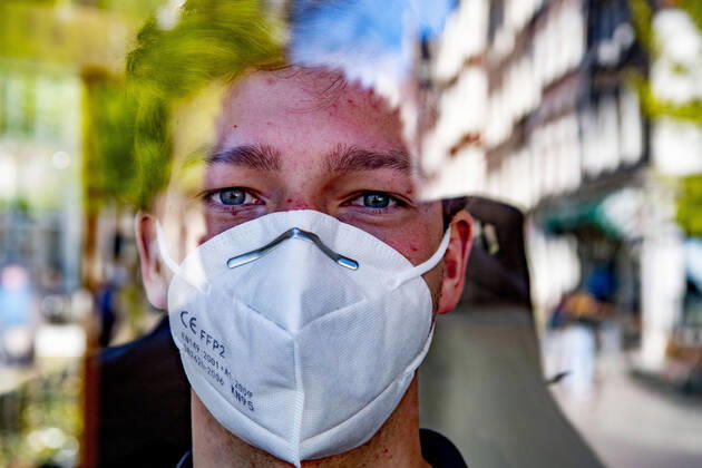 April 19, 2020, Amsterdam, Netherlands: A man wearing a face mask as a protective measure against the spread of Coronavirus at the store..Opening a face mask store during the corona crisis is very critical. Certified surgical face masks would be sold for 9 euros each and the store can only take cash. Amsterdam Netherlands - ZUMAs197 20200419_zaa_s197_034 Copyright: xRobinxUtrechtx