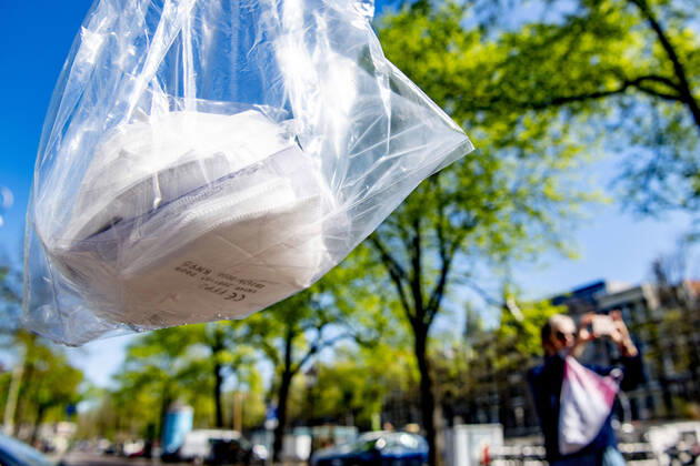 April 19, 2020, Amsterdam, Netherlands: Surgical face mask on sell at the store..Opening a face mask store during the corona crisis is very critical. Certified surgical face masks would be sold for 9 euros each and the store can only take cash. Amsterdam Netherlands - ZUMAs197 20200419_zaa_s197_040 Copyright: xRobinxUtrechtx