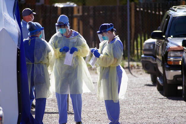 April 19, 2020, Albuquerque, NEW MEXICO, USA: 041920 ..Medical personnel performs a drive-thru Coronavirus Screening at Lovelace Hospital in Downtown Albuquerque l.Photographed on Sunday April 19, 2020.Adolphe Pierre-LouisJournal. Albuquerque USA - ZUMAab1_ 20200419_zaf_ab1_003 Copyright: xAlbuquerquexJournalx