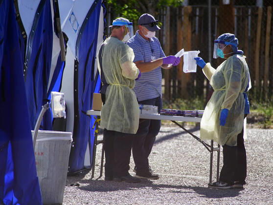 April 19, 2020, Albuquerque, NEW MEXICO, USA: 041920 ..Medical personnel performs a drive-thru Coronavirus Screening at Lovelace Hospital in Downtown Albuquerque l.Photographed on Sunday April 19, 2020.Adolphe Pierre-LouisJournal. Albuquerque USA - ZUMAab1_ 20200419_zaf_ab1_002 Copyright: xAlbuquerquexJournalx