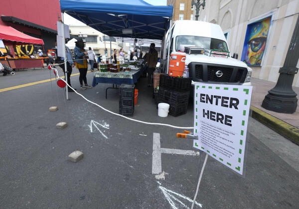 April 19, 2020, Los Angeles, California, U.S: A sign reminds people to a Farmer s Market practice social distancing during the Covid-19 crisis in Los Angeles, Sunday, April 19, 2020. Los Angeles U.S. - ZUMAc68_ 20200419_zaf_c68_019 Copyright: xRingoxChiux