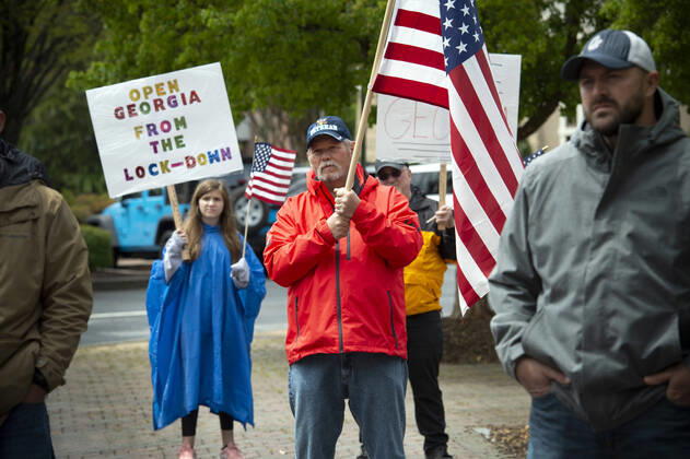 April 19, 2020, Canton, GA: A group of self-described conservative Ã patriots gather outside Cherokee County Courthouse on Sunday April 19 to protest the states Ã shelter in place orders because of the COVID19 pandemic.Several were armed with AR-15 weapons. Organizers voiced a list of grievances against the state, arguing citizens rights were being violated because of the orders, and vow to ignore state mandate. Canton - ZUMAn03_ 20200419_zaf_n03_003 Copyright: xRobinxRaynex