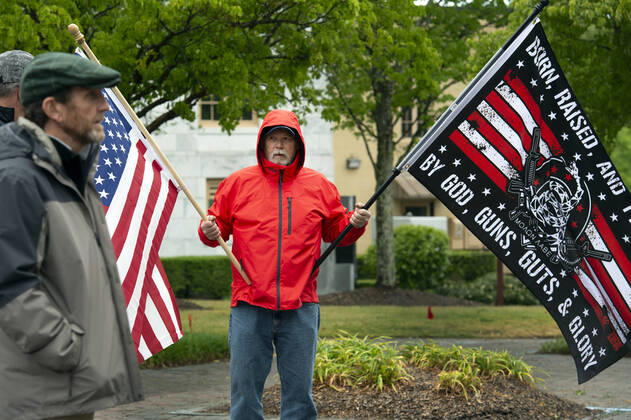 April 19, 2020, Canton, GA: A group of self-described conservative Ã¢â‚¬ËœpatriotsÃ¢â‚¬â ¢ gather outside Cherokee County Courthouse on Sunday April 19 to protest the stateÃ¢â‚¬â ¢s Ã¢â‚¬Ëœshelter in placeÃ¢â‚¬â ¢ orders because of the COVID19 pandemic.Several were armed with AR-15 weapons. Organizers voiced a list of grievances against the state, arguing citizenÃ¢â‚¬â ¢s rights were being violated because of the orders, and vow to ignore state mandate. Canton - ZUMAn03_ 20200419_zaf_n03_007 Copyright: xRobinxRaynex