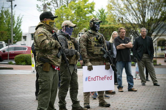 April 19, 2020, Canton, GA: A group of self-described conservative Ã¢â‚¬ËœpatriotsÃ¢â‚¬â ¢ gather outside Cherokee County Courthouse on Sunday April 19 to protest the stateÃ¢â‚¬â ¢s Ã¢â‚¬Ëœshelter in placeÃ¢â‚¬â ¢ orders because of the COVID19 pandemic.Several were armed with AR-15 weapons. Organizers voiced a list of grievances against the state, arguing citizenÃ¢â‚¬â ¢s rights were being violated because of the orders, and vow to ignore state mandate. Canton - ZUMAn03_ 20200419_zaf_n03_008 Copyright: xRobinxRaynex