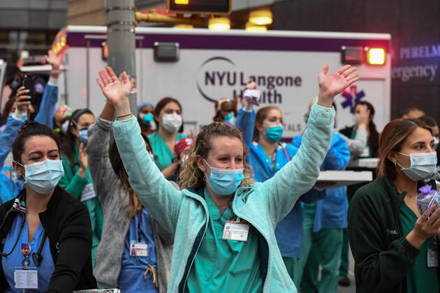 April 19, 2020, New York, New York, United States: Health care workers in Langone Hospital, thank to people cheering them in New York City Sunday at 7 p.m., a nightly ritual that has spread across the city battling against the coronavirus pandemic. New York United States - ZUMAl113 20200419_zap_l113_003 Copyright: xMiguelxJuarezxLugox
