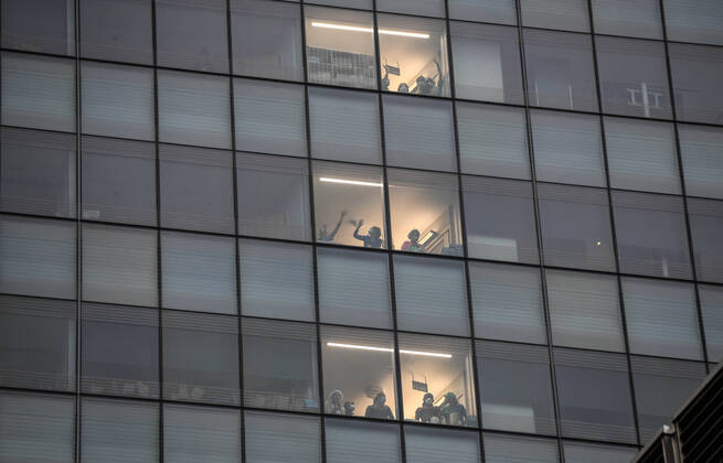 April 19, 2020, New York, New York, United States: Health care workers from the Covid floors in Langone Hospital, thank to people cheering them in New York City Sunday at 7 p.m., a nightly ritual that has spread across the city battling against the coronavirus pandemic. New York United States - ZUMAl113 20200419_zap_l113_004 Copyright: xMiguelxJuarezxLugox