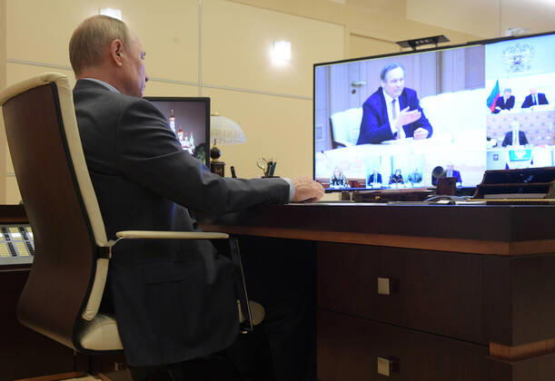 MOSCOW REGION, RUSSIA - APRIL 20, 2020: Russia s President Vladimir Putin during a video conference meeting on the COVID-19 coronavirus situation in Russia, at Novo-Ogaryovo residence. Alexei Druzhinin Russian Presidential Press and Information Office TASS  TS0D66C7