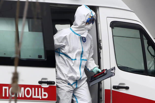 MOSCOW, RUSSIA - APRIL 20, 2020: An emergency paramedic in a protective suit at the Novomoskovsky multipurpose medical center for patients with suspected COVID-19 coronavirus infection. Valery Sharifulin TASS  TS0D66D4
