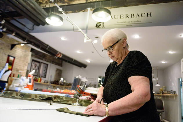 April 20, 2020: Chef Directrice DAGMAR HARTMANN can be seen during the process of making a mask in the manufacture of the Luxury Tie Auerbach in the Hackesche HoÂ¶fe in Berlin Mitte. The company produces mouth-nose-masks made of noble fabrics, partly matching ties or bow ties. - ZUMAs172 20200420_zap_s172_022 Copyright: xJanxScheunertx