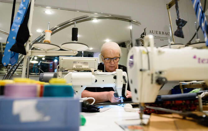 April 20, 2020: Chef Directrice DAGMAR HARTMANN can be seen during the process of making a mask in the manufacture of the Luxury Tie Auerbach in the Hackesche HoÂ¶fe in Berlin Mitte. The company produces mouth-nose-masks made of noble fabrics, partly matching ties or bow ties. - ZUMAs172 20200420_zap_s172_026 Copyright: xJanxScheunertx